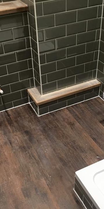 Green tiling, oak finished timber work with amtico wood effect flooring.